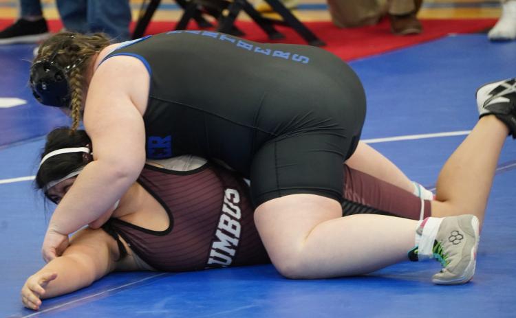 Loralie Logan works on flipping her opponent, Natalia Lopez of Columbus, over for the pin. PCN photo by Jen Vrbka.