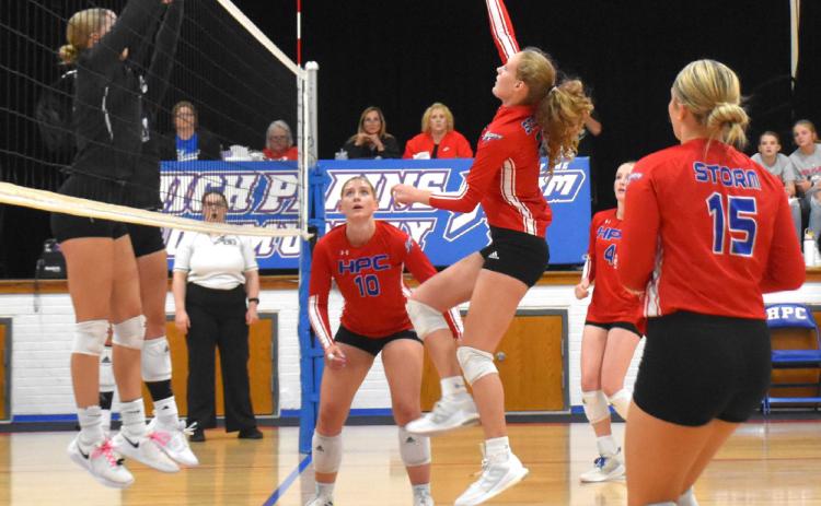 Rylee Hofmann hits one up to the Titan’s block. PCN photo by Beth Sparrow