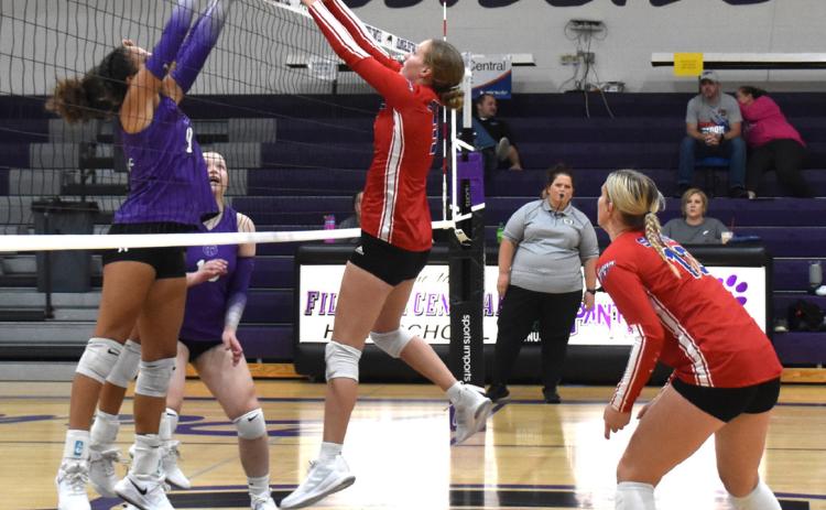 Rylee Hofmann goes up for a block against Fillmore Central on Thursday as Courtney Carlstrom backs her up. PCN photo by Beth Sparrow.