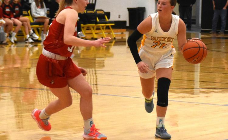 Kaylei Perry dribbles around a Meridian defender. PCN photo by Alex Larmon.