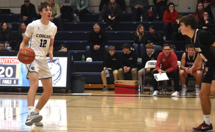 Thatcher Hanson crosses half court with the ball and looks for a shot or a pass. PCN photo by Kirk Sparrow.