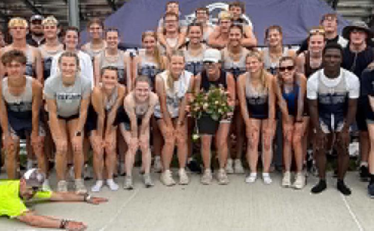 Coach Jessica Jackman is leaving Cross County so the track team recognized her at districts with a gift. PCN photo by Rick Holtz.