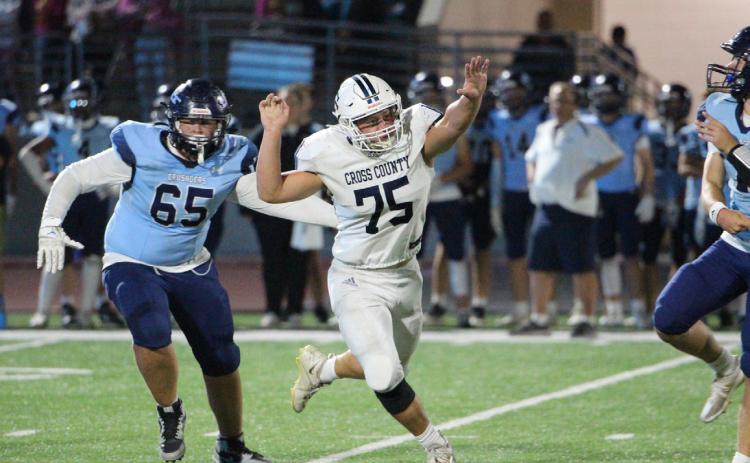 Mason Quilhot tries to block a pass by GICC. PCN photo by Travis Lane.