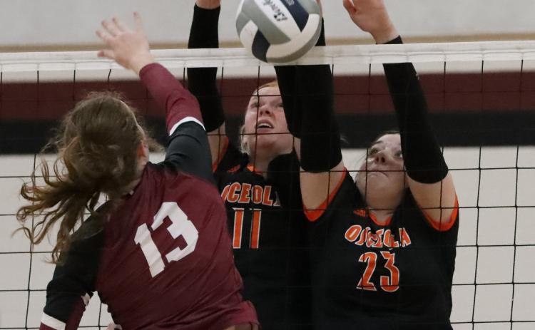 Eastyn Kropatsch and Bella Recker go up for the block against Heartland. PCN photo by Blaine Winslow.
