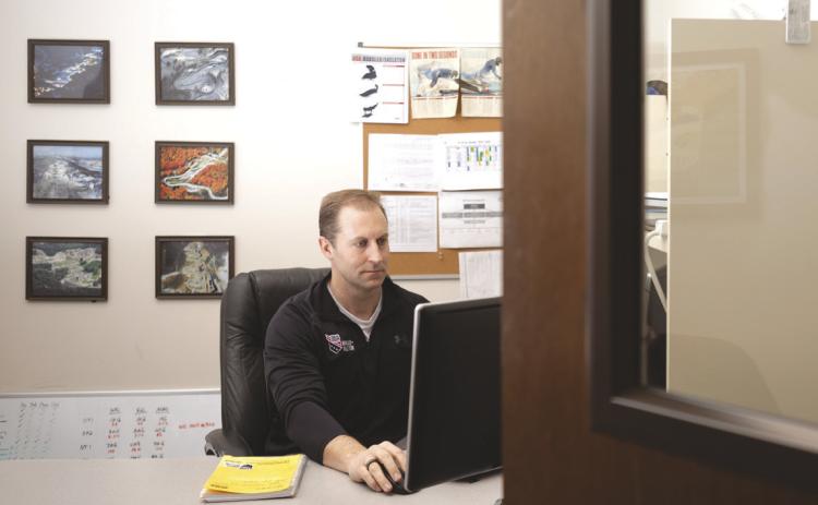 Bobsledding decorations surround Curt Tomasevicz’s desk in his office in Chase Hall, on the University of Nebraska-Lincoln’s East Campus. Tomasevicz has stayed involved in the U.S. National Bobsled and Skeleton teams since his last Winter Olympics appearance in 2014, now serving as director of sport performance for the teams. Even his academic work ties in — Tomasevicz’s Ph.D. was on bobsledding physiology. Photo by Liz McCue for the Flatwater Free Press