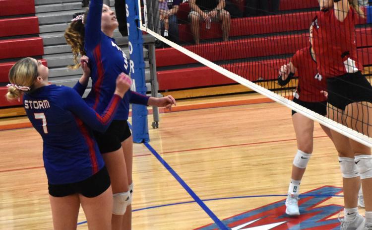 Rylee Hofmann gets a kill against Sandy Creek; she had two in the contest. PCN photo by Beth Sparrow.