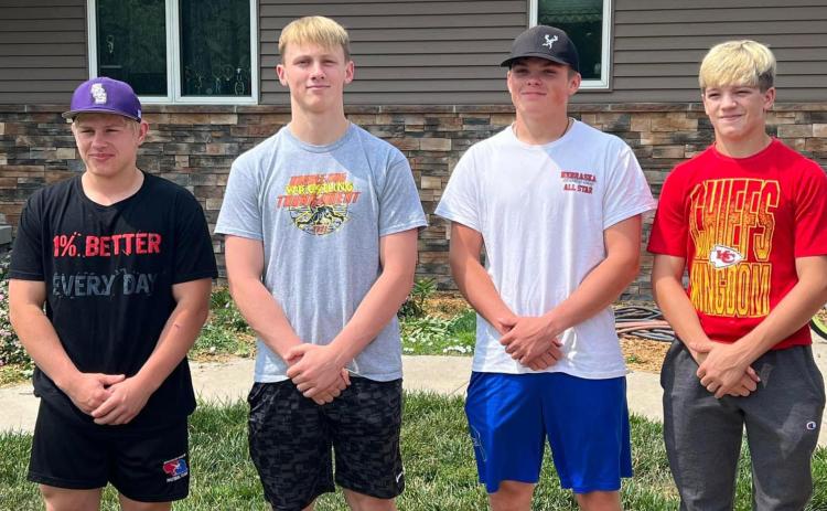 Eli Fjell (SRC), Coy Vrbka (SRC), Wyatt Urkoski (HPC) and Devin Nuttelman (CC) wrestled at Disney Duals in Orlando, Florida. Photo provided.