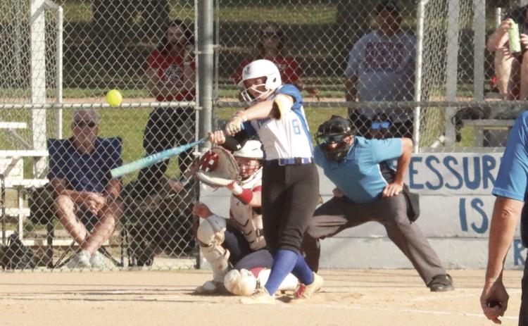 Blue River senior Abby Lindsley launches a three-run first inning home run to give the Panthers a 3-0 lead. Adams Central came back with an eight run fourth and ended the year for Blue River in the 14-09 loss. PCN photo By Ken Kush