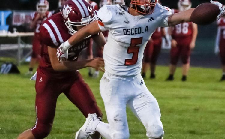 Osceola junior Brycen Kula (5) reaches out to stretch the ball past the goal line. Kula ran for six touchdowns and 327 yards in Osceola 46-14 win at Fullerton. PCN photo by Blaine Winslow.