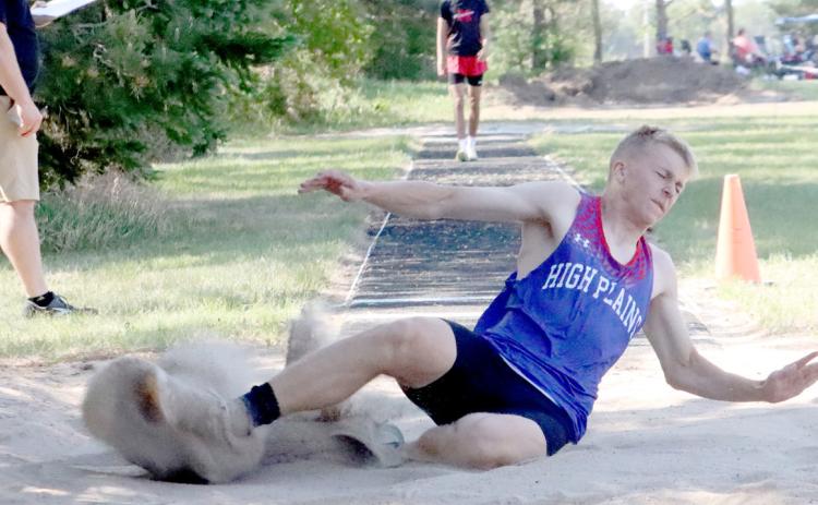 Top: High Plains junior Brodey Spurling splashes down into the pit in the triple jump. Spurling won both the triple and the long jump on Wednesday. He also was on the Storm’s 4x100 relay which also qualified.