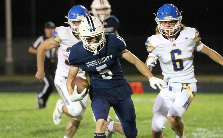 Thatcher Hanson runs the ball for the two points after. PCN photo by Travis Lane.