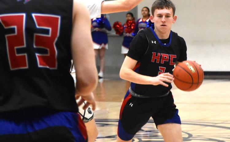 Carson Swedenburg dribbles around a defender while Brodey Spurling is ready to receive. PCN file photo by Beth Sparrow.