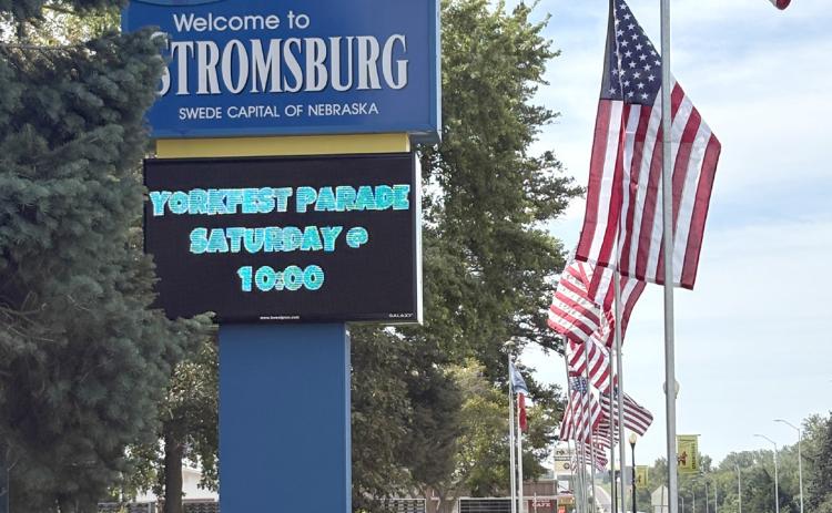 Stromsburg has a new sign on the highway with a larger display as shown on Friday with the flags. PCN photo by Beth Sparrow.