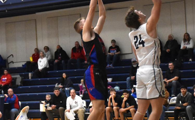 Langdon Arbuck (CC) puts the ball up as Brodey Spurling (HPC) goes up to rebound. PCN photo by Beth Sparrow.