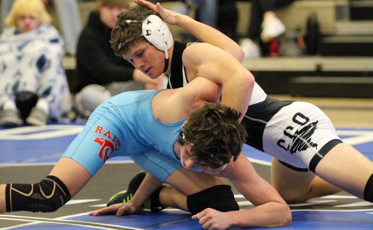 Top- Cross County/Osceola junior Jed Berggren was the bracket champion at 150 pounds.