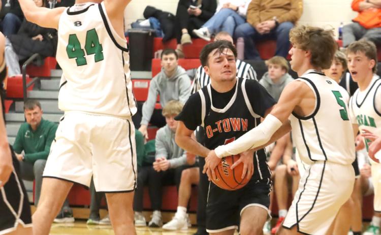 Osceola senior Brayden Santos never shied away from taking to the ball to the hoop against the Bergan Catholic Knights stacked post game. Santos led Osceola with 15 points in the loss to No. 1 Bergan. PCN photo by Ken Kush.