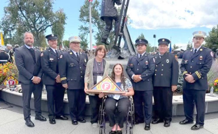 Above: Erika Burritt holds the award presented to them in honor of her father. Pictured are Gary Bruns (IAFF Neb. St. Pres.), Tom Rathje, JoJo Dunn, Aaron Perez, Dave HOgelin, Derek Salak. Below: David Burritt’s name incribed on the wall. Photos provided.