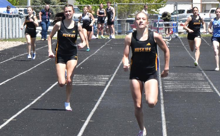 The Shelby-RC duo of Danica Watts (right) and Leah Whitmore (left) placed first and second respectively in both the 200 and 400 meter races. Watts also won both the long jump and the triple jump giving her a 40-point day at the Cross County Invite. PCN photo by Rick Holtz