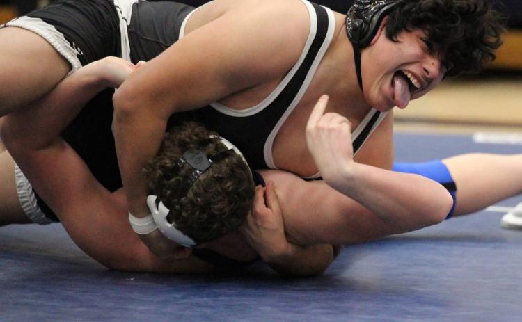Joaquin Alvarez-Rodriguez is happy to pin his Nebraska Christian opponent in the triangular held last week. PCN photo by Travis Lane.