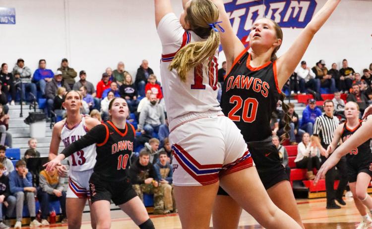 HallieJo Urkoski (HPC) and Halle Gabel go for the ball. PCN photo by Blaine Winslow.