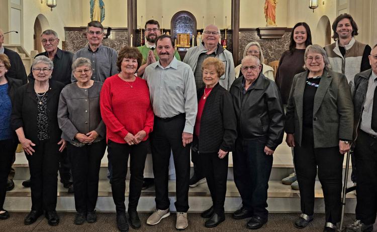 Pictured with Father Litt are the honored couples and those celebrating 50 or more years of marriage this year. Photo provided.