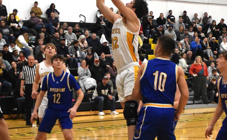 Freshman Dylan Micek goes for a basket against Riverside. PCN photo by Beth Sparrow.