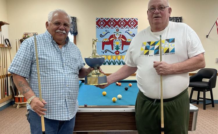 Karl Eckert and Terry Noyd recently brought the county pool trophy to Stromsburg. PCN photo by Rick Holtz