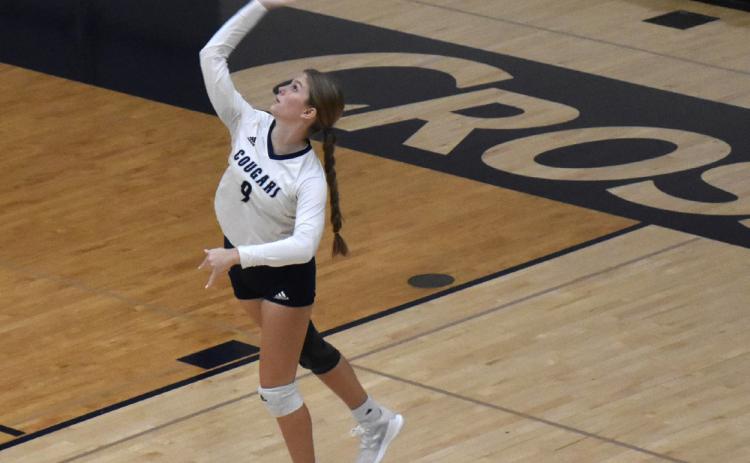 Lucy Berggren serves one at the game against North Bend Central. PCN photo by Beth Sparrow.