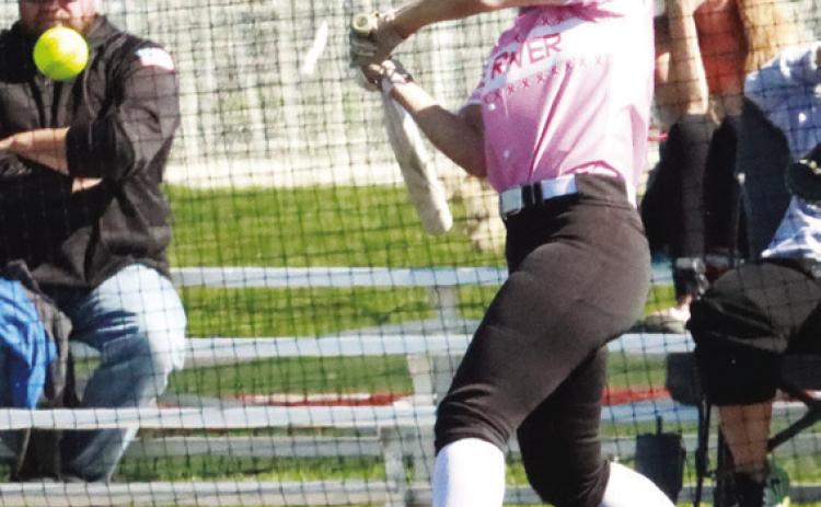Top left- Blue River’s Jayden Hayes singles to center moving two runners into scoring position during Friday’s game in Lincoln. Top right- Lead-off hitter Taylor Slonecker gets the first of her two steals against Raymond Central. PCN photo by ken Kush.