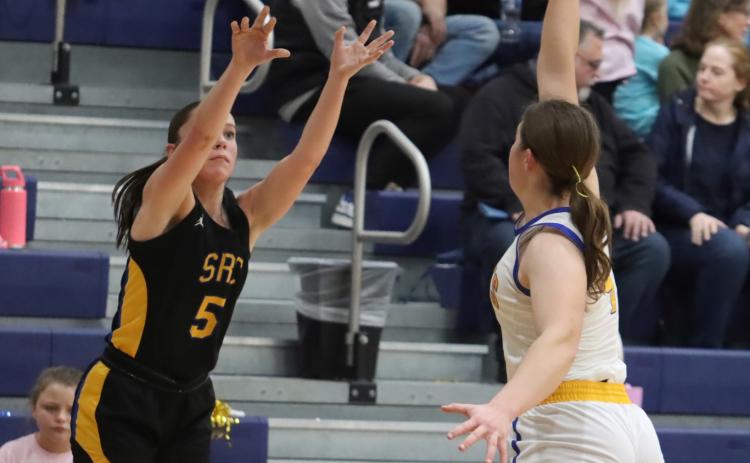 Shelby-RC junior Kaleigh Ruth fires up the baseline jumper at Nebraska Lutheran. PCN photo By Ken Kush.