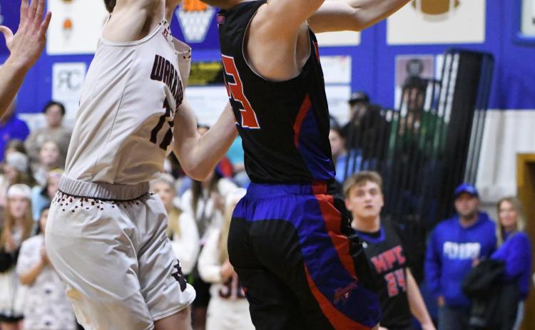 Brodey Spurling tries to put one in against a Warrior. PCN photo by Rick Holtz.