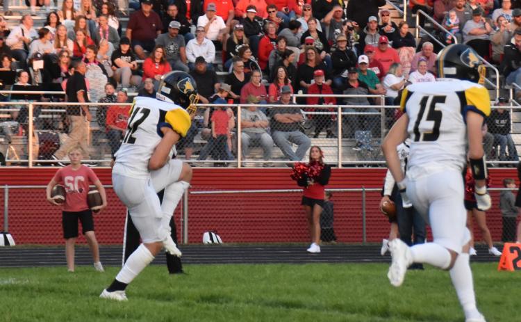 Jett Vrbka gets a kickoff return as Blake Schmidt runs beside. PCN file photo by Beth Sparrow.