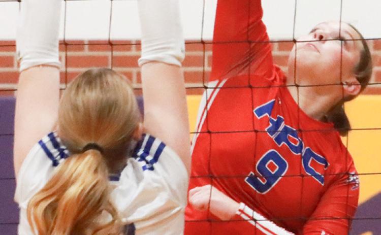 Left-Senior HallieHJo Urkoski with one of her 14 kills in the match with Shelton. Right- Sophomore Ava Lindburg digs up the Shelton serve during first set action at the D2-5 subdistrict in Elba on Monday.PCN photos by Ken Kush