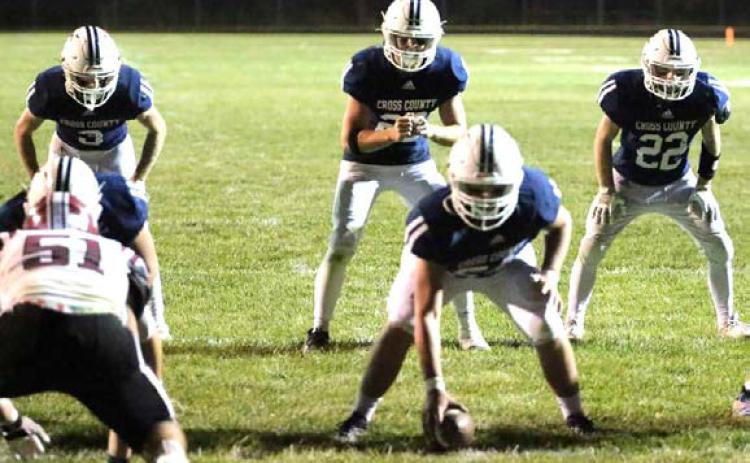 Carson Schaefer is ready for the snap from Gabe Donnelly. Eli Greenwall and Tony DeWitt are ready to block. PCN photo by Travis Lane.