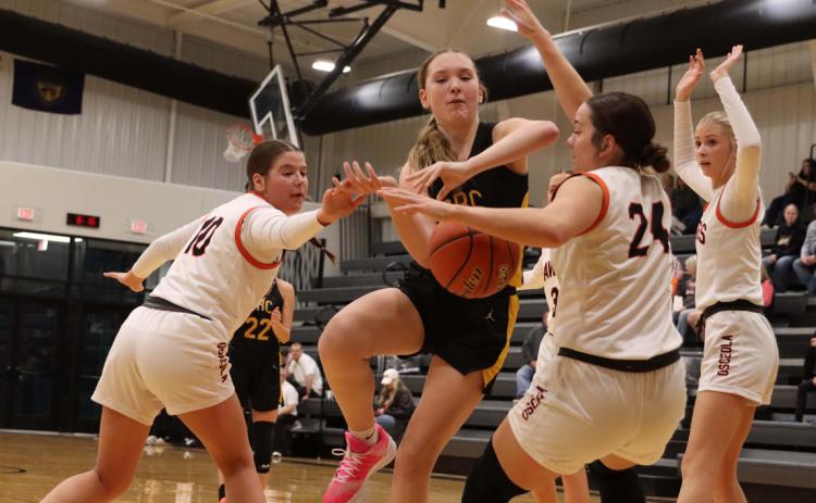 In February, Shelby-Rising City’s Hayden Hopwood tries to get through Osceola’s defense. If Osceola and SRC co-op, this game would not be held. PCN file photo by Blaine Winslow.
