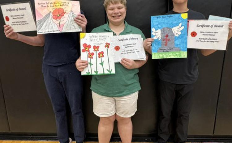 The Osceola Legion Auxiliary awarded some 8th graders for posters and essays. Left are the poppy poster winners: 1st Mason Alexander, 2nd Layton Burritt, 3rd Dawson Baloun. Right are the essay contest winners: 1st Allison Duhachek, Mason Alexander 2nd and 3rd Milo Vaughn. Mason Alexander was also the History award winner. Photos provided.