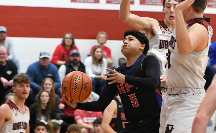 Raul Marino takes the ball to the basket past some Fullerton defenders. PCN photo by Rick Holtz.