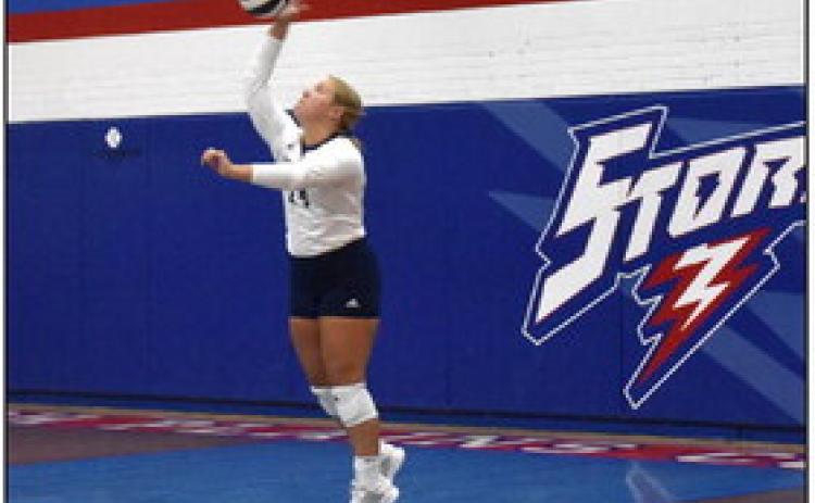 Chesney Sundberg serves one at the High Plains triangular. PCN photo by Beth Sparrow.