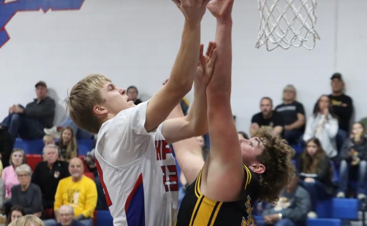 High Plains senior Brodey Spurling (23) is contested at the basket by McCool Junction senior Dylan Gonnerman. Spurling led the Storm with eight points in the loss to the Mustangs and he scored 16 in the win over Dorchester. PCN photo by Ken Kush.