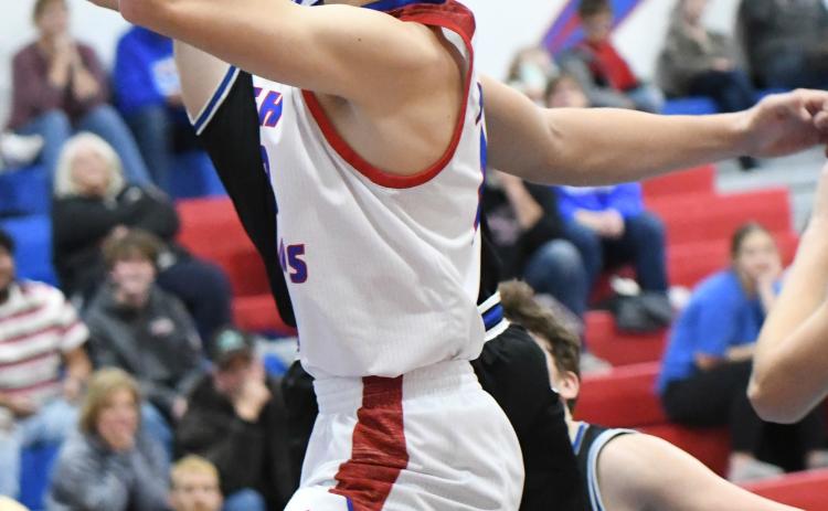 Brodey Spurling gets by his defender on his way to the basket for two of his nine points during High Plains rally late in Friday's 40-37 loss to Exeter-Milligan. PCN photo by Calvin Holtz