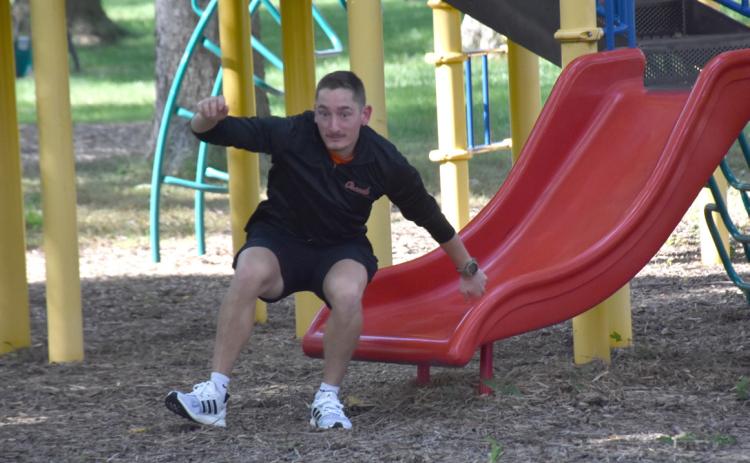Road rally contestant Calvin Finley makes his way down the slide in Osceola. PCN photo by Beth Sparrow.