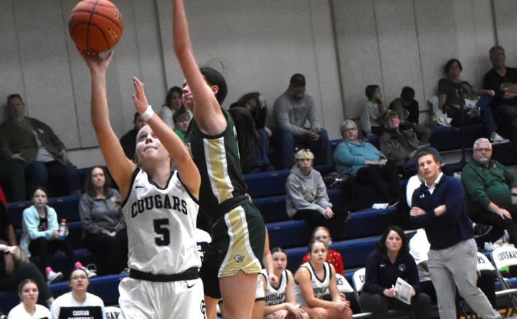 Edie Peterson takes one to the hoop against Central City. PCN file photo by Beth Sparrow.