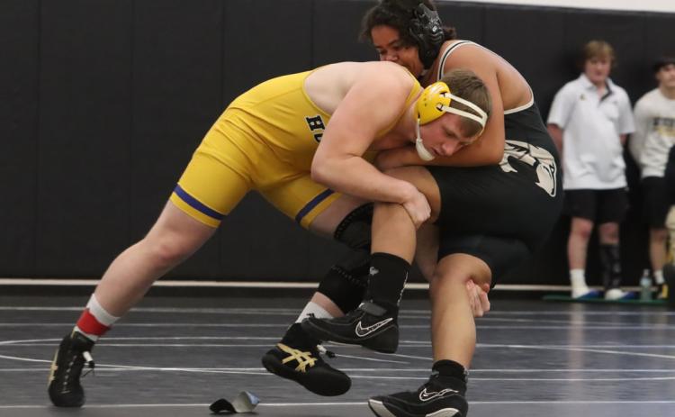 Top- SRC senior Coy Vrbka remained undefeated at 39-0 as he won the 215-pound bracket at the D-3 Meet.