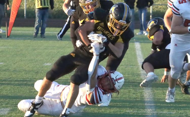 Shelby-RC junior Carter Eickmeier (11) lunges towards the goal line in the team’s win over Sandy Creek earlier this year. Eickmeier finished with 124 yards and one score in the Huskies 54-18 win at Mead on Friday. PCN file photo by Ken Kush.
