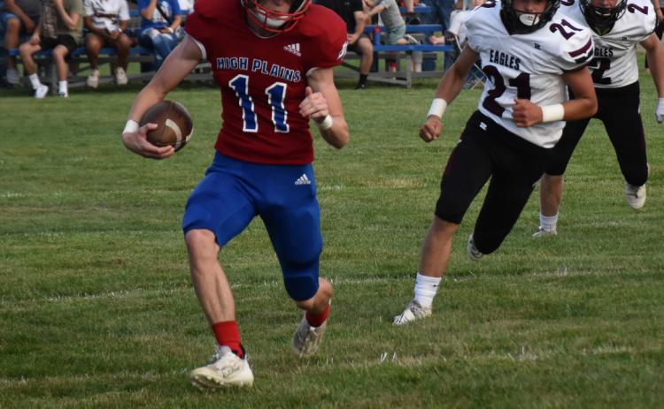 Gavin Morris runs the ball while being pursued by an Eagle defender. PCN photo by Beth Sparrow.
