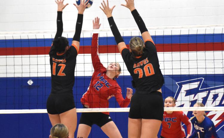 Osceola junior Alexis Burritt (12) and senior Graci Conkling (29) challenge the attack of High Plains freshman Taya Hans (12) during Friday’s season finale at High Plains High School in Polk. PCN photo by Beth Sparrow.
