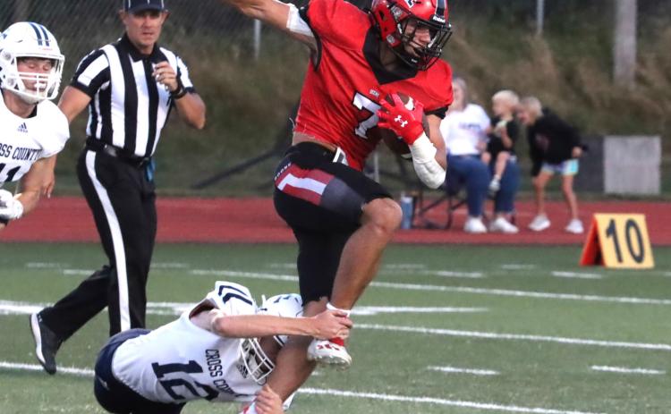 Cross County senior Sawyer Anderson (12) makes a touchdown saving tackle as Boone Central senior Brogan Benes (7) has clear sailing in front of him. Benes accounted for three touchdowns in the Cardinals win. PCN photo by Ken Kush.