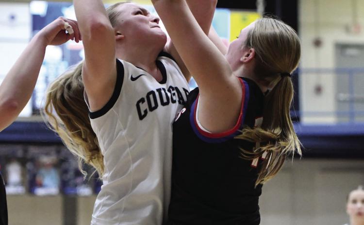 Ema Dickey fights a Humphrey Lindsay defender to the basket. PCN photo by Rick Holtz.