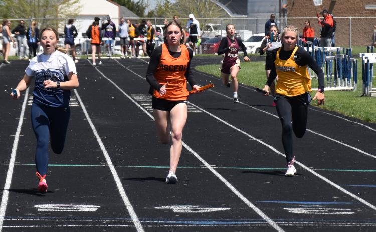 Above: Kylee Krol (CC), Alexis Burritt (OSC) and Danica Watts (SRC) finished the 4x100 relay first, second and third respectively. PCN photo by Beth Sparrow.