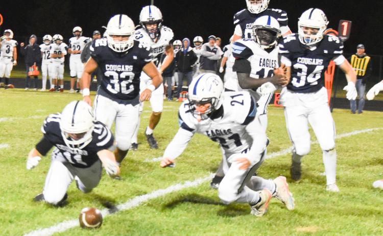 Cross County senior Jed Berggren recovers a Nebraska Christian fumble in the first quarter in Friday night’s district clinching win. PCN photo by Beth Sparrow.